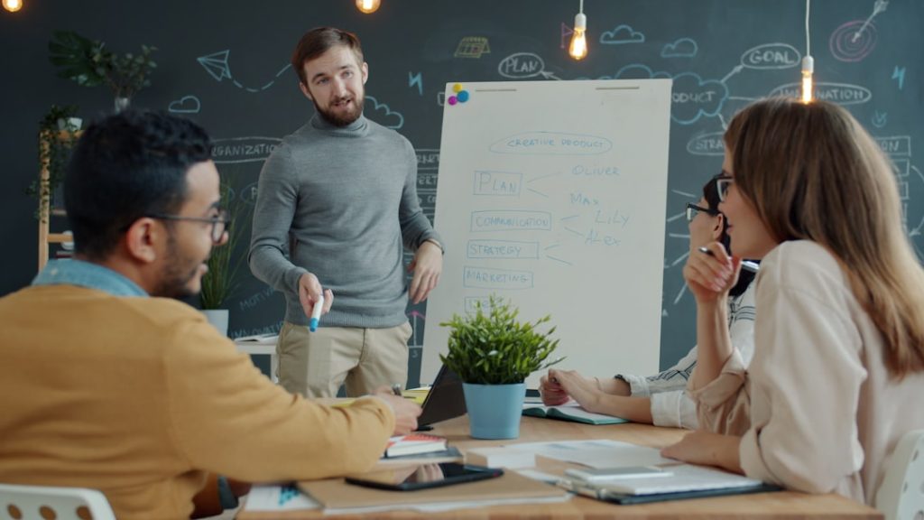 Stop Chasing Clients: A Proactive Guide to Agency Business Development • advertising agency new business development • RED27Creative advertising agency new business development meeting with pipeline strategy discussion